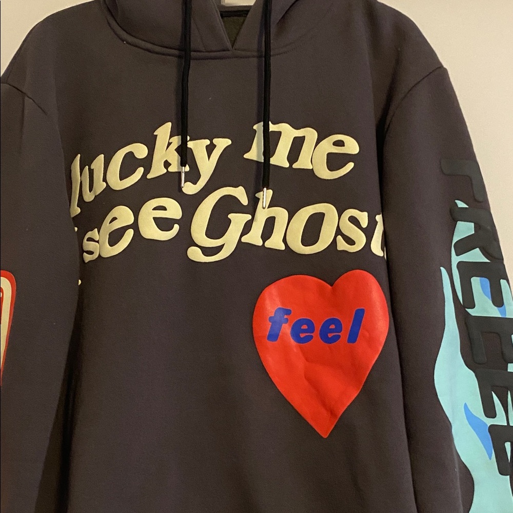 Black Hoodie “ lucky me I see ghosts” emblem on front